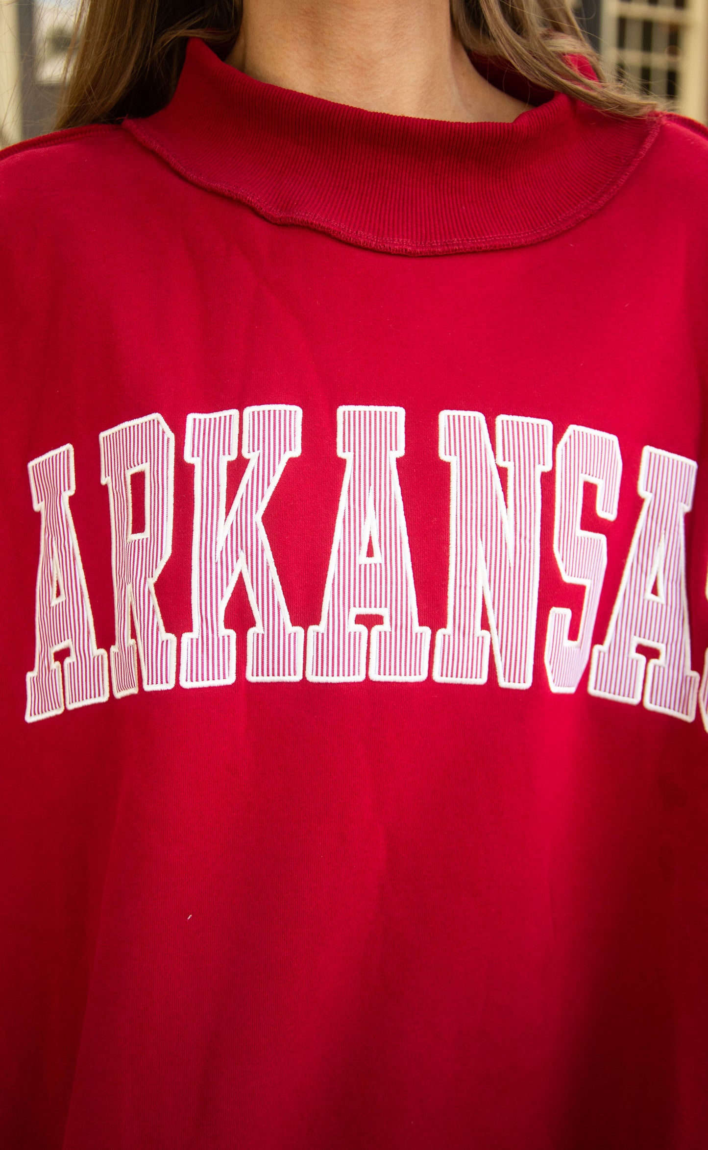 arkansas crimson embroidered mock neck